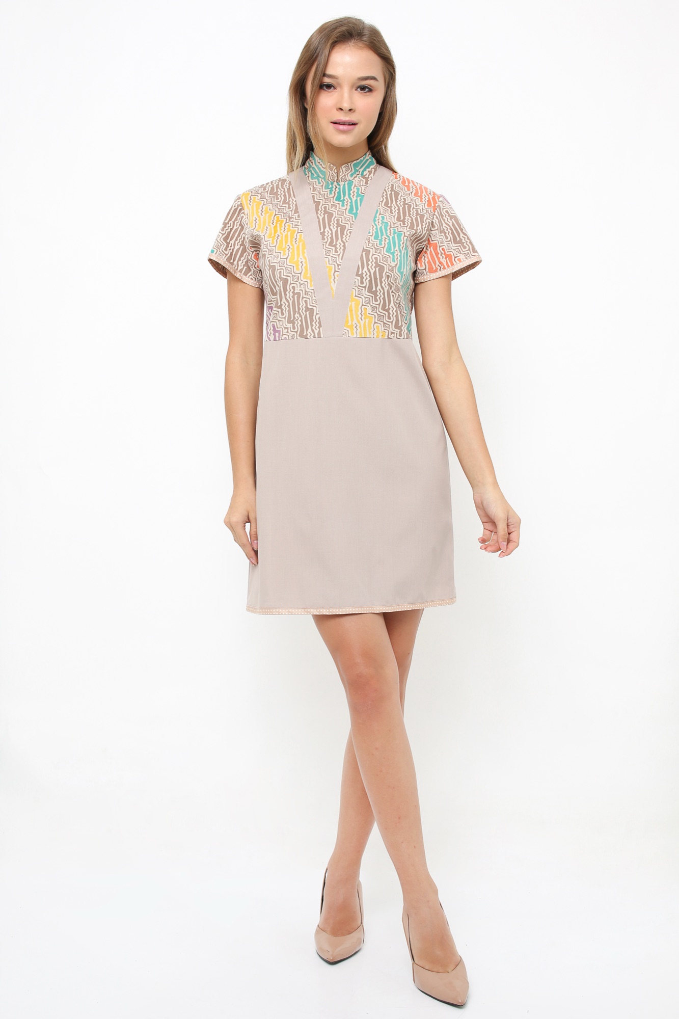 Model wearing Arya Putri Batik taupe dress with colourful parang batik panel