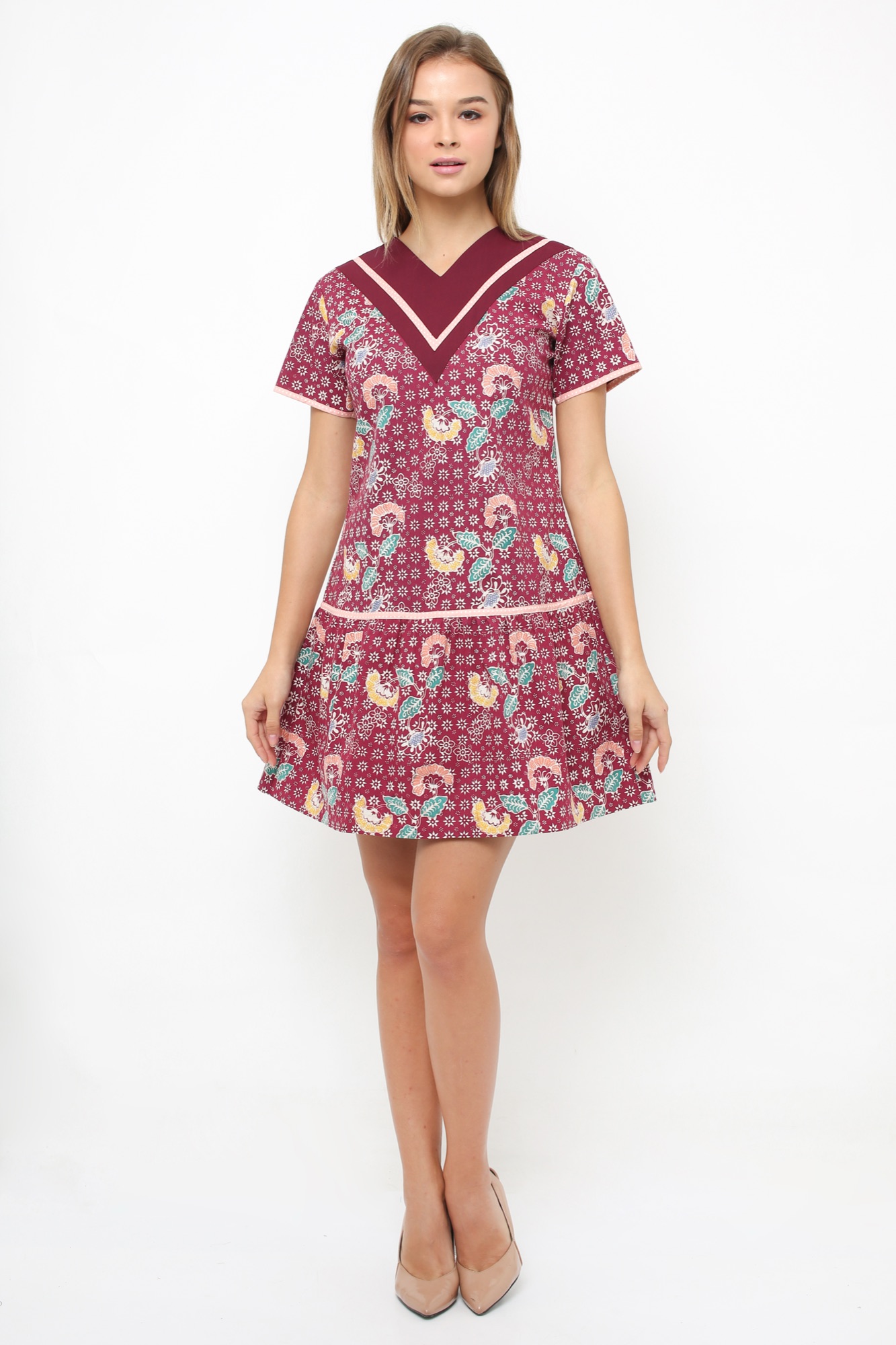 Model wearing Arya Putri Batik maroon floral drop-waist batik dress