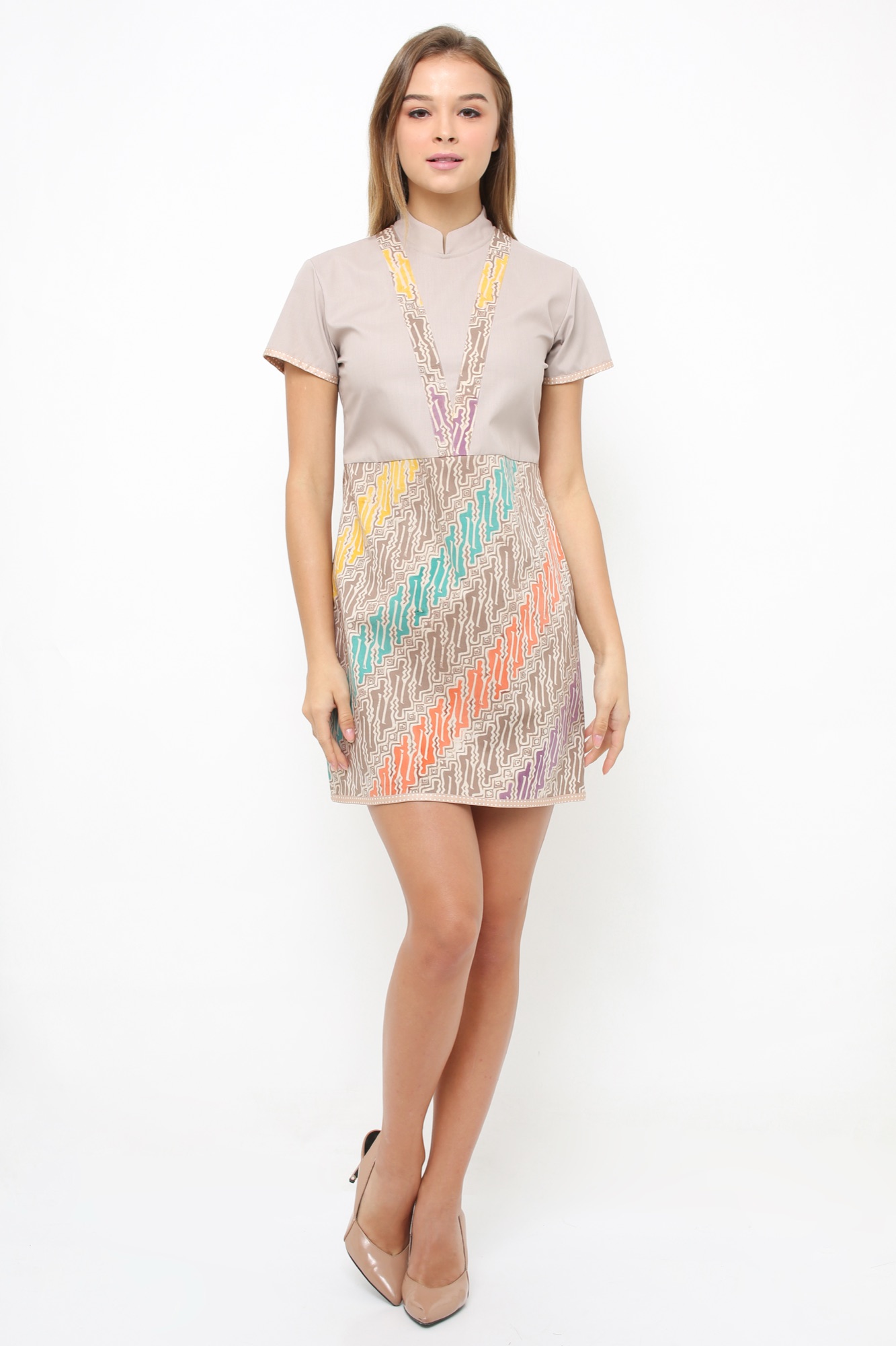 Model wearing Arya Putri Batik shift dress with colourful parang batik skirt