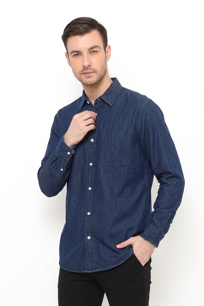 Model wearing an indigo denim button-up shirt