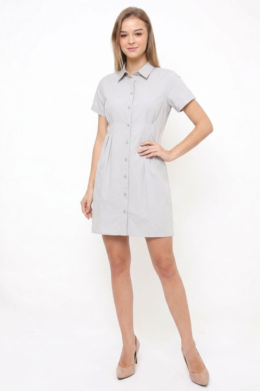Model wearing a light grey short-sleeve shirt dress